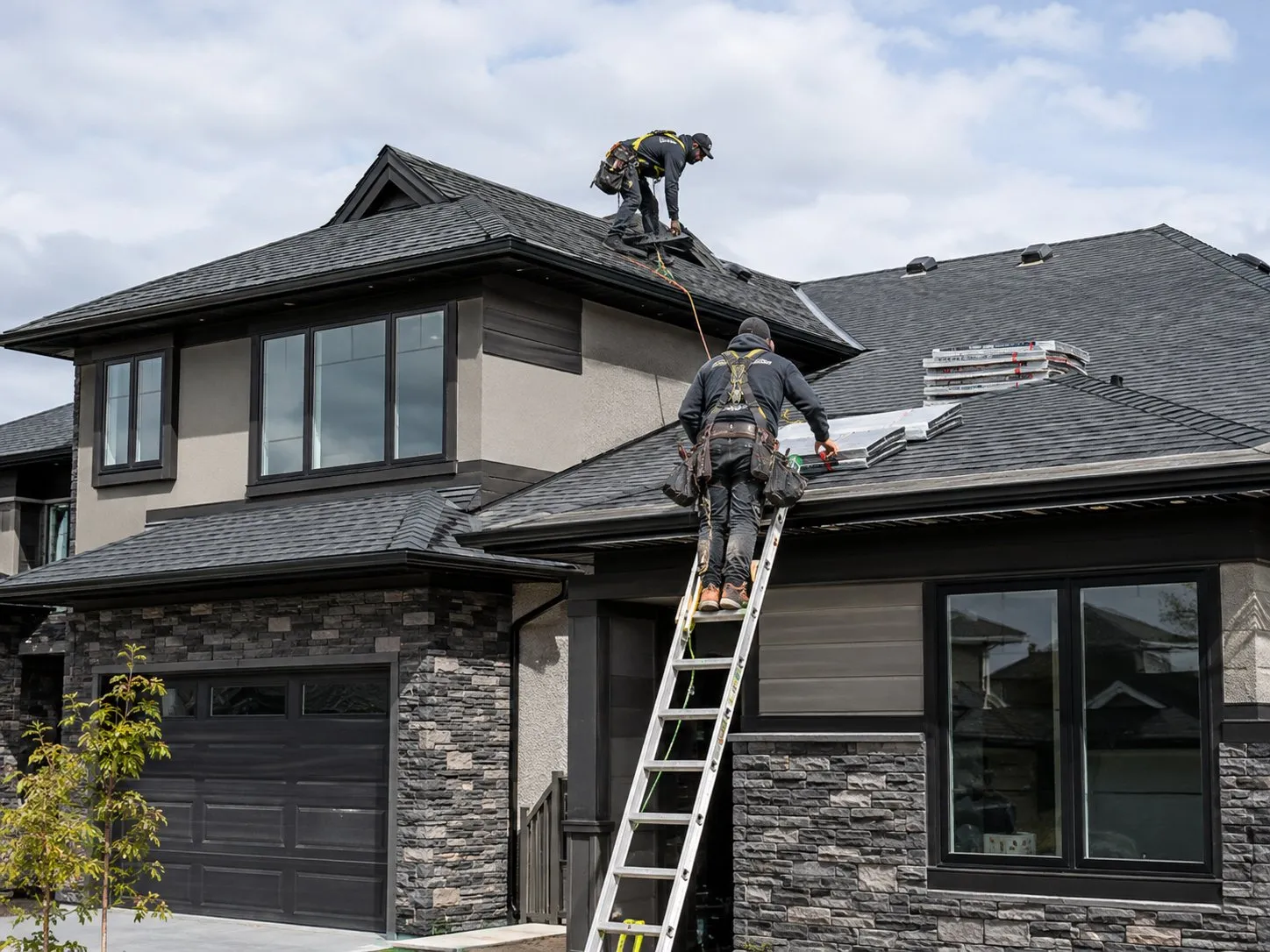 Workers repairing a residential roof